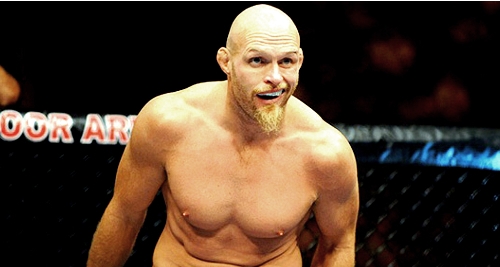 wrestler with big beard bald