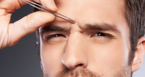 Here is a man pulling off eyebrow hair