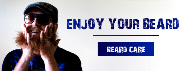 man playing in his beard with his fingers wearing sunglasses - enjoy your beard - beard care