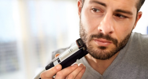 Here is a man trimming his beard with a Philips Series 5000 BT5206/16 Beard Trimmer