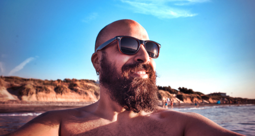 Here is a bearded man on the beach