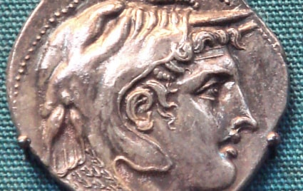 A coin depicting a cleanly shaven Alexander the Great.